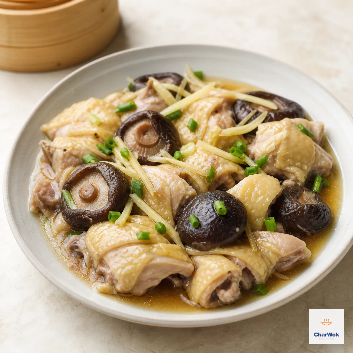 Bone-in steamed chicken pieces with whole shiitake mushrooms, ginger matchsticks, scallion, and pale soy-steaming juices on one shallow plate