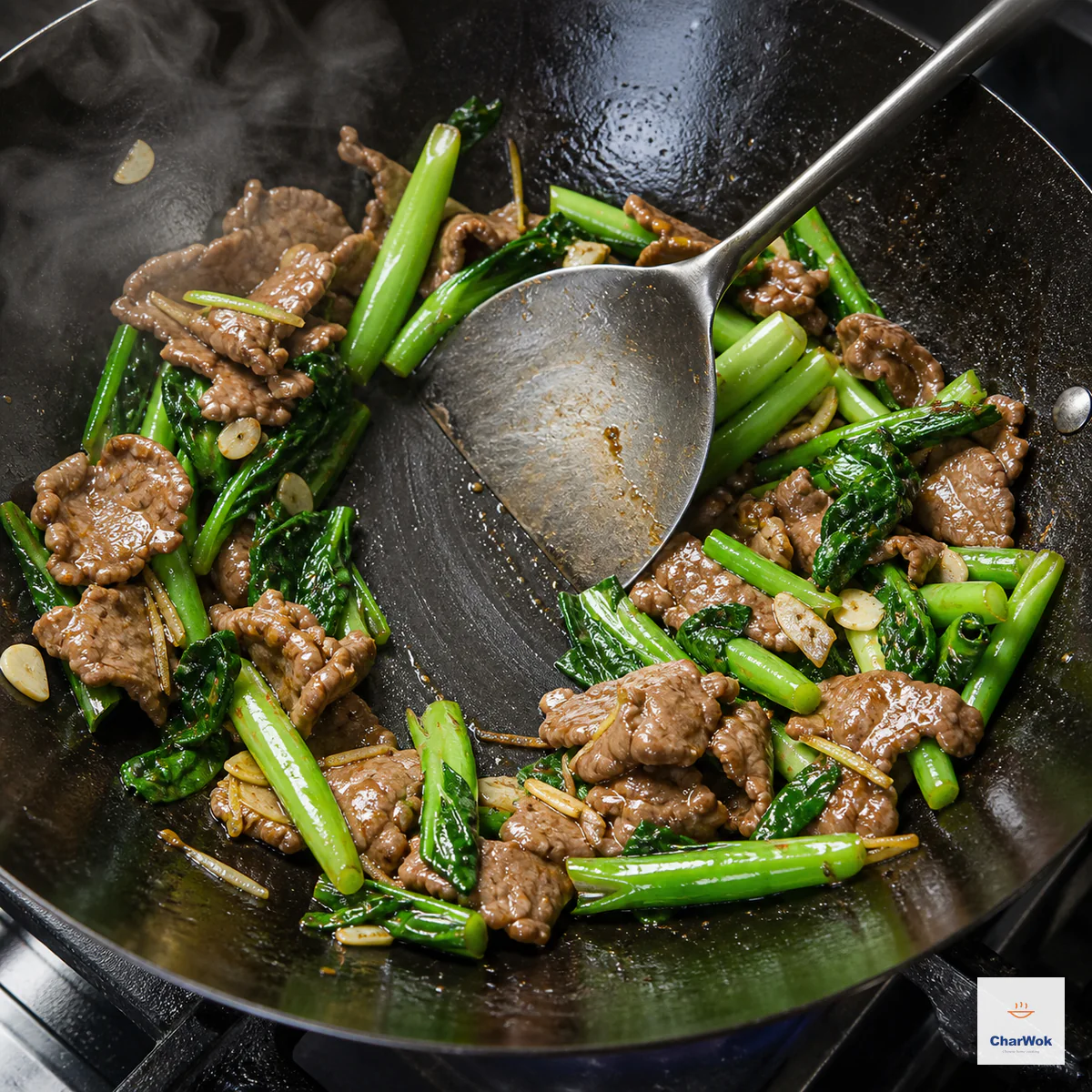 Thin beef and bright-green Chinese broccoli carry a glossy glaze while the spatula leaves a clean trail on the wok with no sauce pool