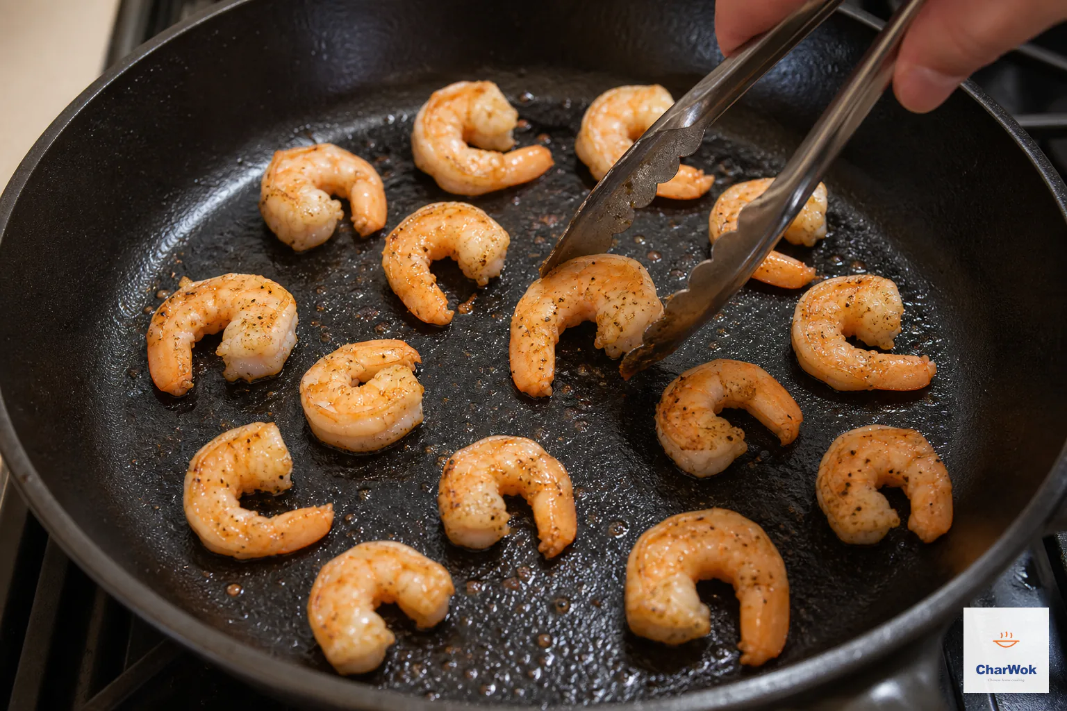 Marinated shrimp sear in one uncrowded skillet layer and turn opaque pink while remaining in distinct open C shapes