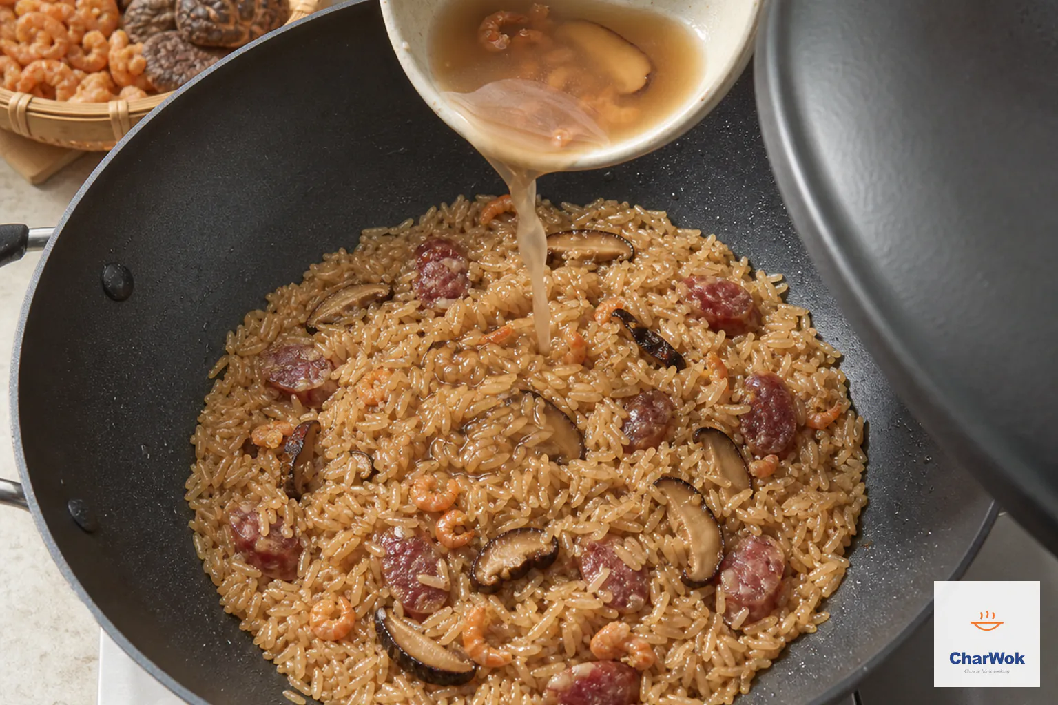 Another half a cup of saved soaking liquid is poured into partially swollen brown sticky rice after the previous addition has evaporated