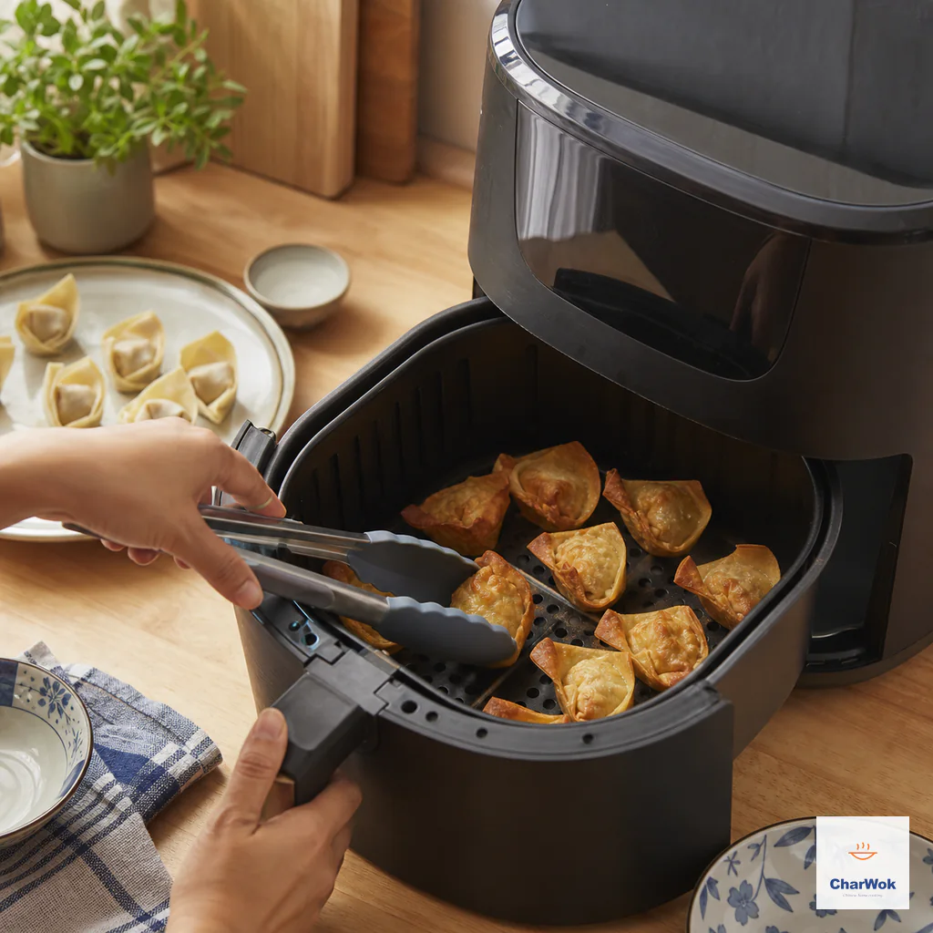 Tongs rotate golden wontons between air-fryer basket positions before their filling temperature is checked