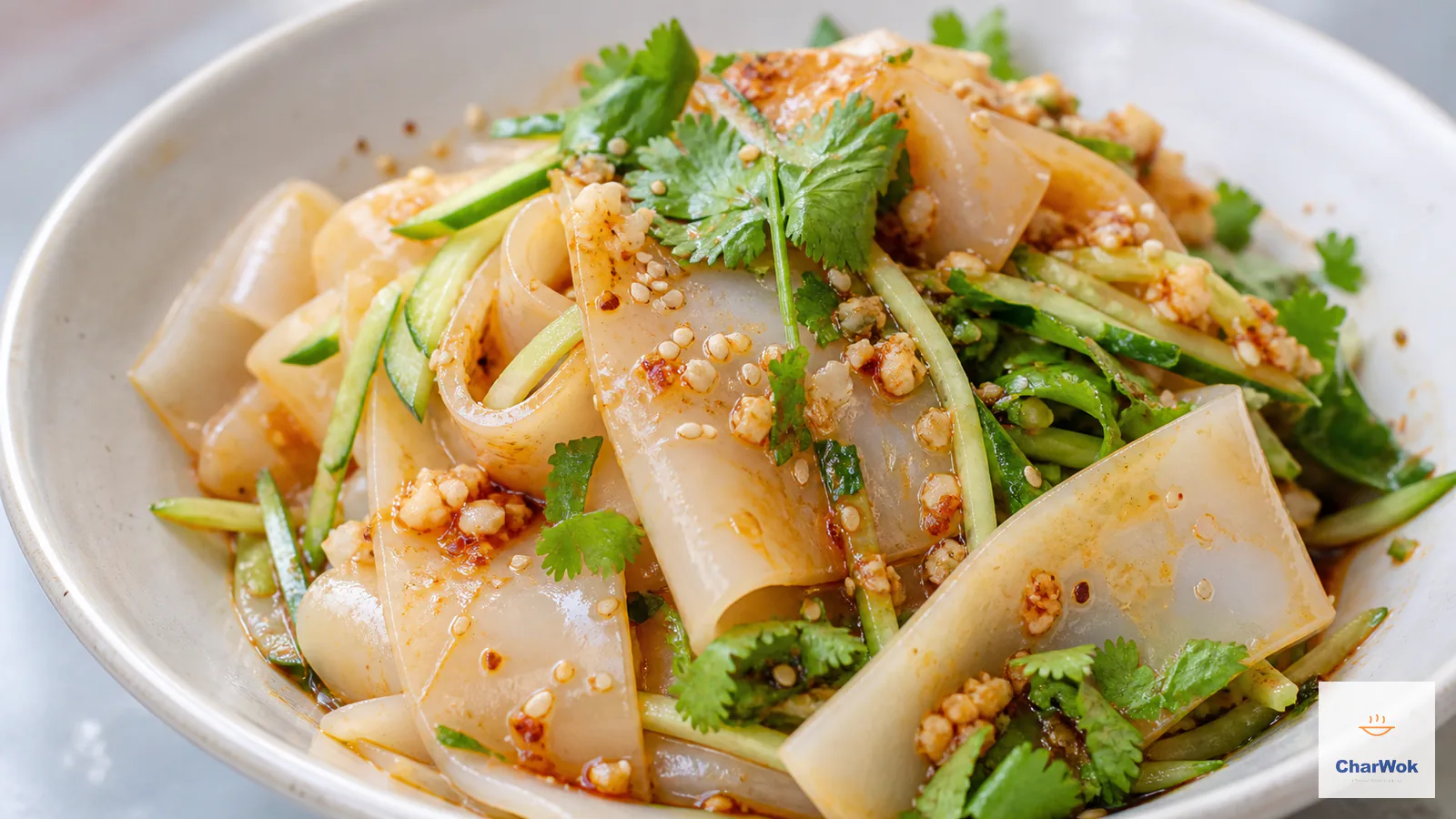 Translucent Liang Pi ribbons with cucumber, cilantro, sesame and chili oil