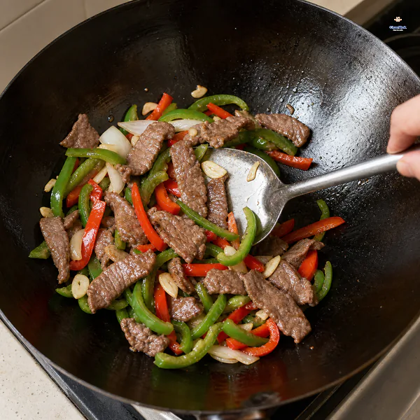 Seared beef strips are tossed with crisp bell peppers, onion and garlic before any brown sauce is added