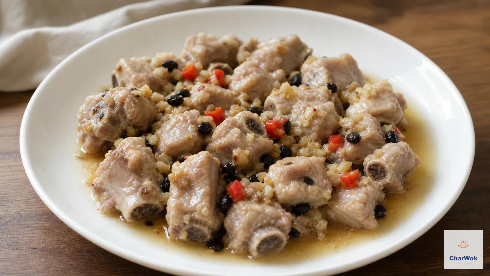Steamed bite-size pork ribs with fermented black beans, garlic, red chilli and scallion in savory juices